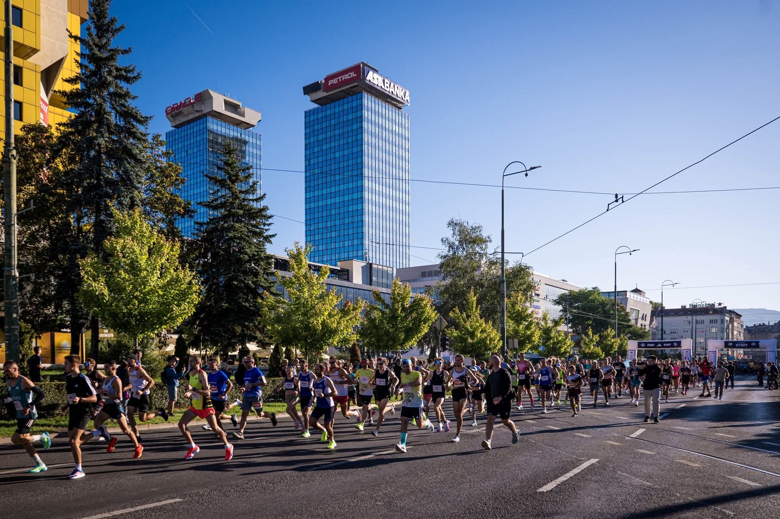 Runners passing Ottoman and Austro-Hungarian architecture in central Sarajevo